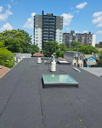Flat roof skylight installation by Alba Tech Roofing