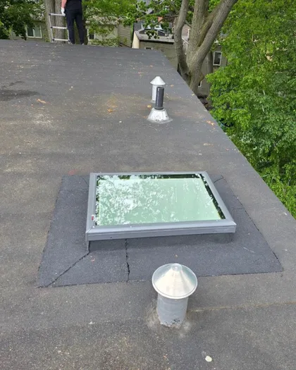 Flat roof skylight installation in progress